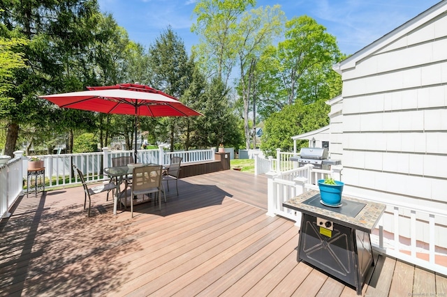 35 Hampton Ln, Stamford, CT 06903 - deck with outdoor dining area, area for grilling, and view of scattered trees