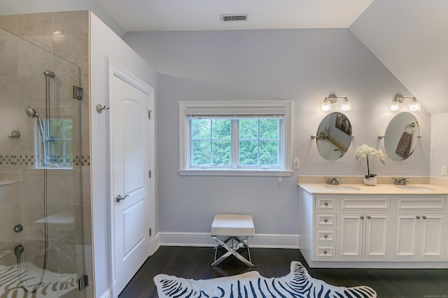 72 S Salem Rd, Ridgefield, CT 06877 - full bathroom with double vanity, a shower stall, wood finished floors, baseboards, and vaulted ceiling