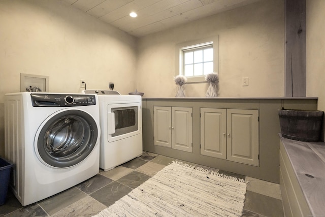washroom featuring washer and clothes dryer, cabinet space, marble finish floor, recessed lighting, and wood ceiling