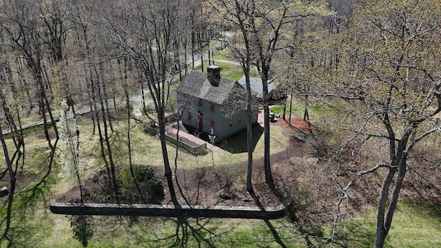 exterior space featuring a wooded view
