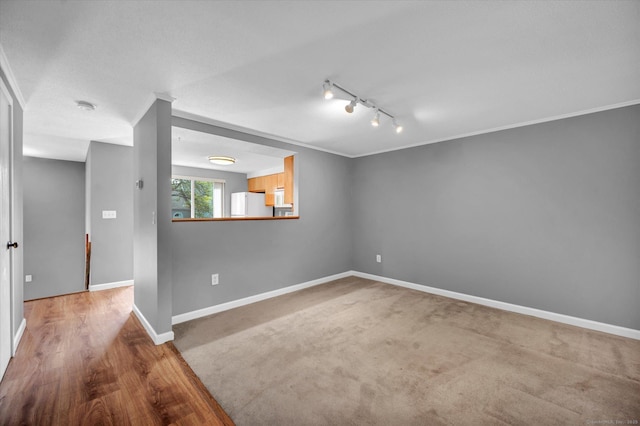 37 Valley Run Dr Unit 37, Cromwell, CT 06416 - empty room with track lighting, baseboards, crown molding, and wood finished floors