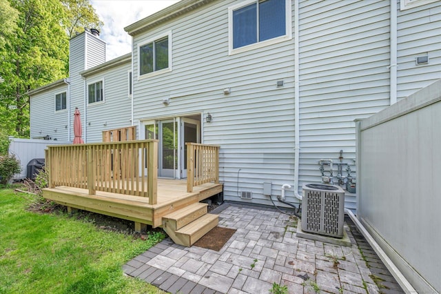 37 Valley Run Dr Unit 37, Cromwell, CT 06416 - back of house with central AC, a patio area, a wooden deck, a chimney, and a lawn
