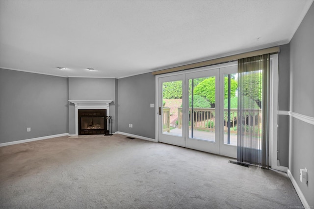 37 Valley Run Dr Unit 37, Cromwell, CT 06416 - unfurnished living room featuring carpet floors, a fireplace with flush hearth, and baseboards