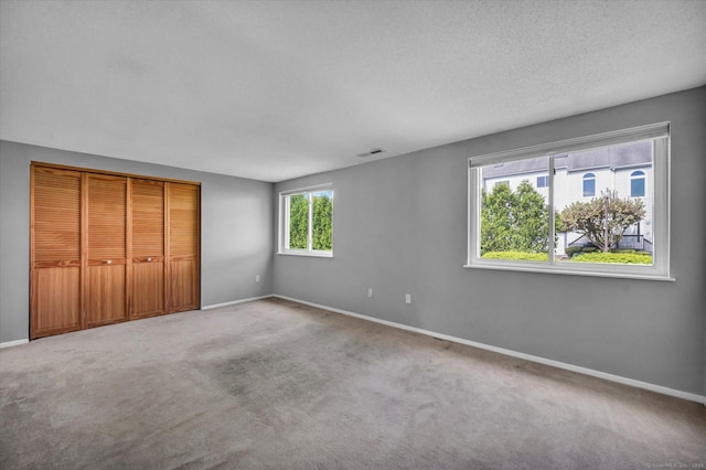 37 Valley Run Dr Unit 37, Cromwell, CT 06416 - unfurnished bedroom with baseboards, carpet, and a textured ceiling