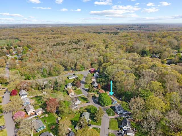 birds eye view of property with a forest view