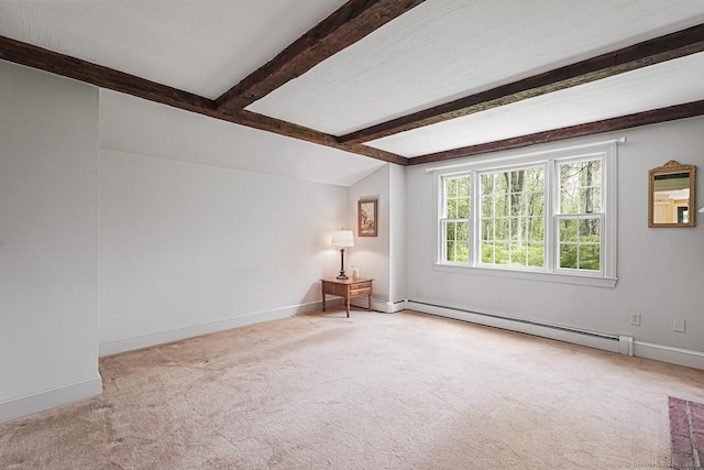 empty room with lofted ceiling with beams, a baseboard radiator, carpet, and baseboards