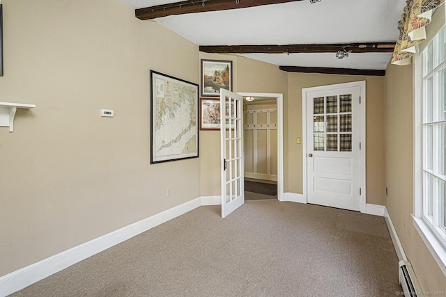interior space featuring baseboards, beamed ceiling, french doors, and plenty of natural light