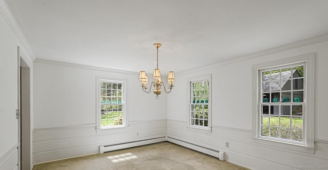 carpeted spare room with a chandelier, ornamental molding, a baseboard radiator, and plenty of natural light