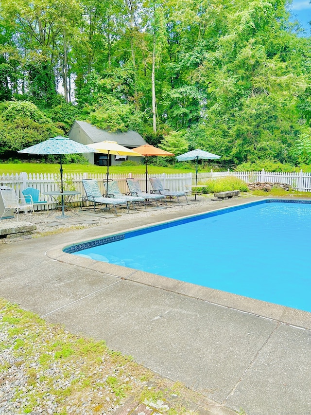 view of pool with a patio, fence, and a fenced in pool