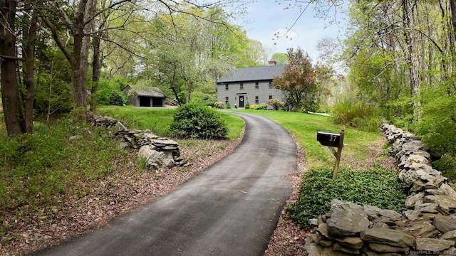 37 Pulpit Rock Rd, Woodstock, CT 06281 - view of front of home with a chimney and a front yard