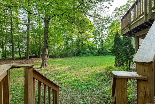 16 Wakerobin Rd, Norwalk, CT 06851 - view of green lawn with a deck