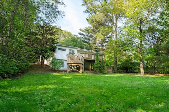 16 Wakerobin Rd, Norwalk, CT 06851 - rear view of house featuring a wooden deck and a lawn