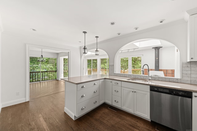 16 Wakerobin Rd, Norwalk, CT 06851 - kitchen with dishwasher, a sink, tasteful backsplash, ornamental molding, and arched walkways