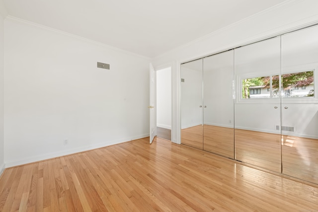 16 Wakerobin Rd, Norwalk, CT 06851 - unfurnished bedroom featuring ornamental molding, wood finished floors, and baseboards