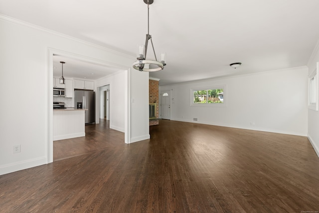16 Wakerobin Rd, Norwalk, CT 06851 - unfurnished living room with dark wood-type flooring, ornamental molding, and baseboards