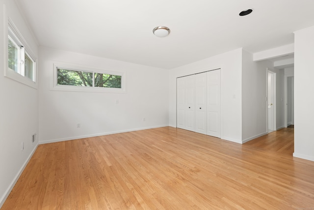 16 Wakerobin Rd, Norwalk, CT 06851 - unfurnished bedroom with light wood finished floors, baseboards, and a closet