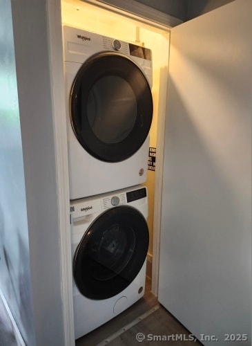 58 Evergreene Unit 58, Wallingford, CT 06492 - laundry room featuring stacked washer / dryer