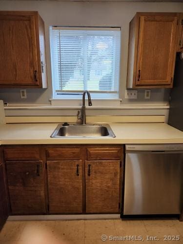 58 Evergreene Unit 58, Wallingford, CT 06492 - kitchen featuring dishwasher, a sink, light countertops, and brown cabinets