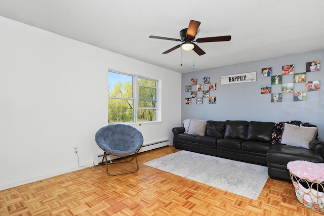 living area featuring a ceiling fan and a baseboard heating unit