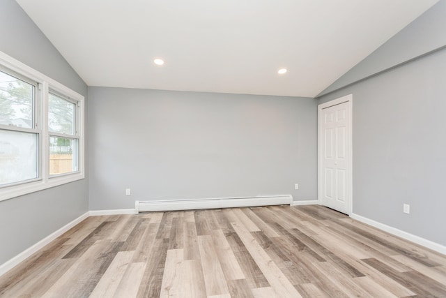 75 Edwards St, Bridgeport, CT 06606 - unfurnished room featuring lofted ceiling, light wood-style floors, baseboard heating, baseboards, and recessed lighting