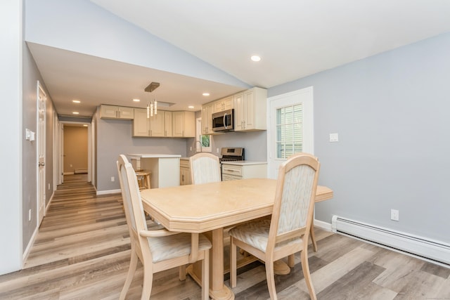 75 Edwards St, Bridgeport, CT 06606 - dining space with baseboard heating, light wood finished floors, vaulted ceiling, recessed lighting, and baseboards