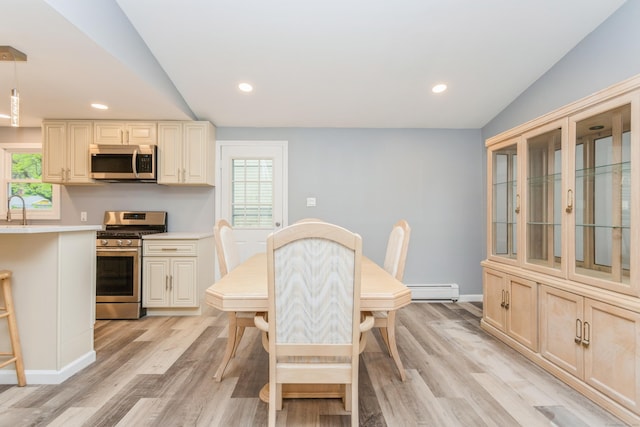 75 Edwards St, Bridgeport, CT 06606 - dining area featuring baseboard heating, light wood-style flooring, plenty of natural light, and recessed lighting