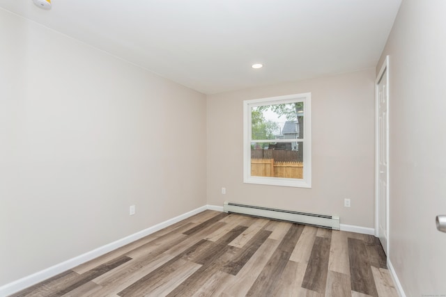 75 Edwards St, Bridgeport, CT 06606 - unfurnished room with a baseboard radiator, wood finished floors, baseboards, and recessed lighting
