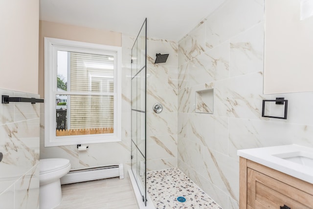 75 Edwards St, Bridgeport, CT 06606 - bathroom featuring a baseboard radiator, a tile shower, toilet, and vanity