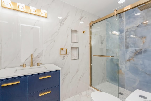 75 Edwards St, Bridgeport, CT 06606 - full bath featuring toilet, tile walls, a marble finish shower, vanity, and marble finish flooring