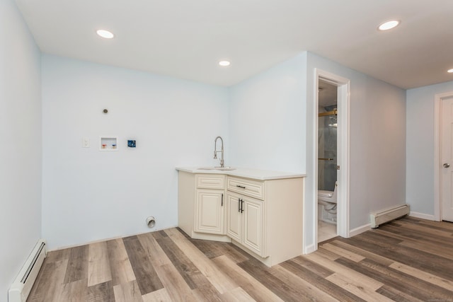 75 Edwards St, Bridgeport, CT 06606 - laundry area with a baseboard heating unit, electric dryer hookup, washer hookup, light wood-type flooring, and recessed lighting