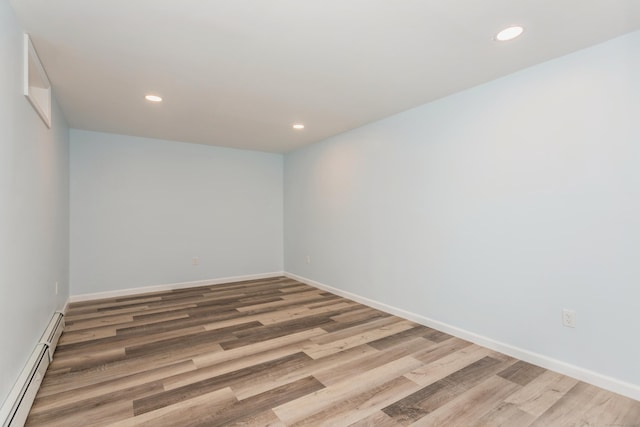 75 Edwards St, Bridgeport, CT 06606 - unfurnished room with baseboard heating, wood finished floors, recessed lighting, and baseboards