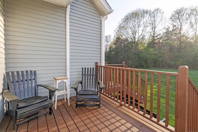 wooden terrace with a lawn
