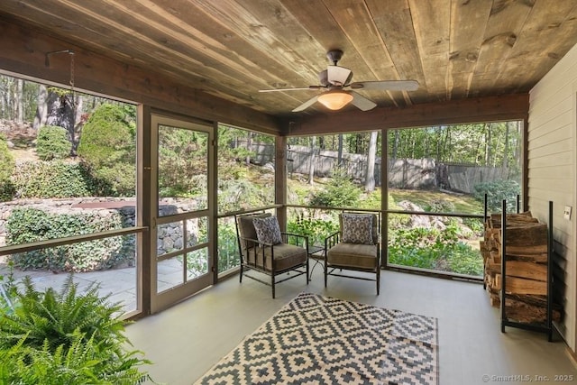sunroom / solarium with a ceiling fan