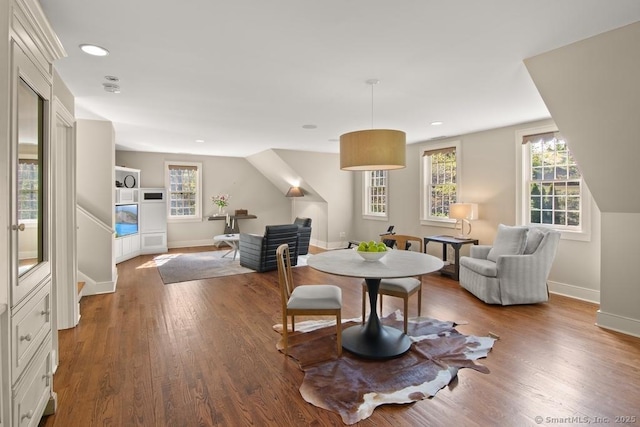 interior space with wood finished floors, baseboards, and recessed lighting