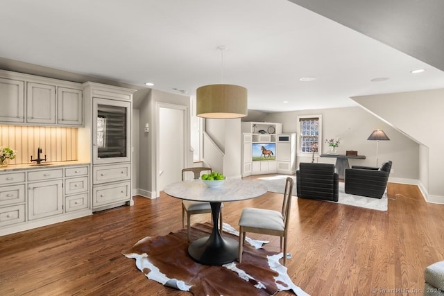 dining room featuring dark wood-style floors, baseboards, and recessed lighting