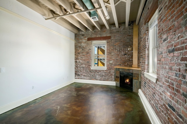 43 Chestnut St Unit 106, New Haven, CT 06511 - unfurnished living room featuring brick wall, finished concrete flooring, a warm lit fireplace, and beam ceiling