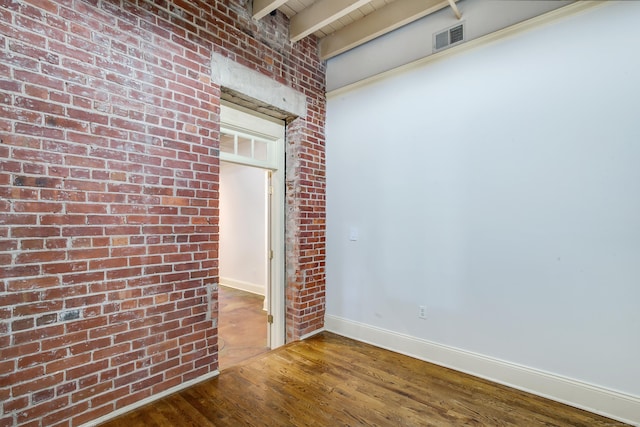 43 Chestnut St Unit 106, New Haven, CT 06511 - empty room featuring wood finished floors, brick wall, and beamed ceiling