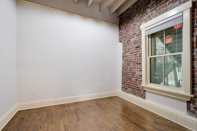 43 Chestnut St Unit 106, New Haven, CT 06511 - spare room with wood finished floors, beamed ceiling, and brick wall