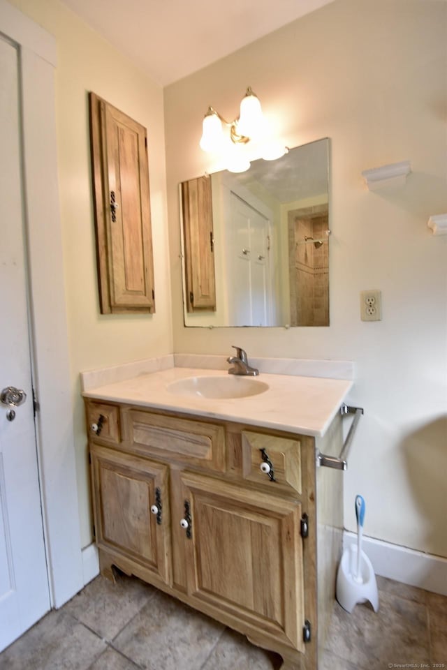 bathroom featuring tile patterned floors and vanity