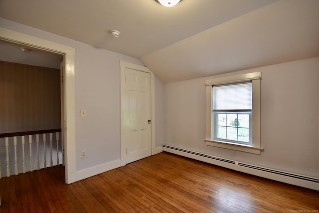 bonus room with baseboards, baseboard heating, lofted ceiling, and hardwood / wood-style floors