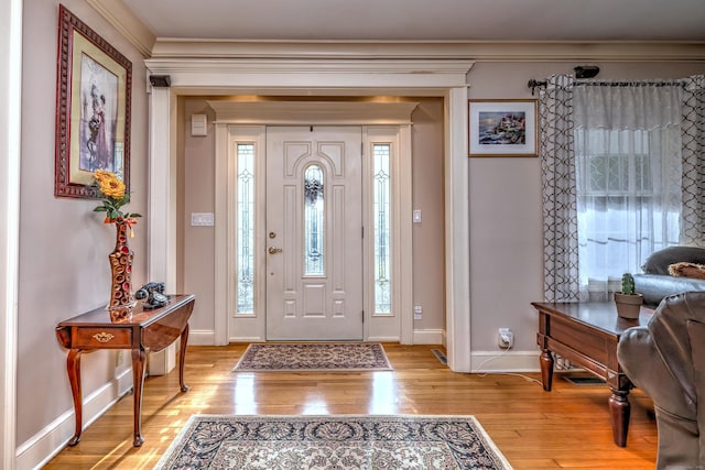 1440 Straits Tpke, Middlebury, CT 06762 - foyer with light wood-type flooring, ornamental molding, baseboards, and a healthy amount of sunlight