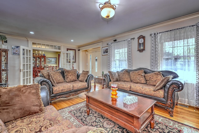 1440 Straits Tpke, Middlebury, CT 06762 - living room featuring french doors, a notable chandelier, ornamental molding, and wood finished floors