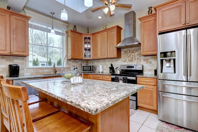 1440 Straits Tpke, Middlebury, CT 06762 - kitchen with light stone counters, wall chimney exhaust hood, stainless steel appliances, a ceiling fan, and glass insert cabinets