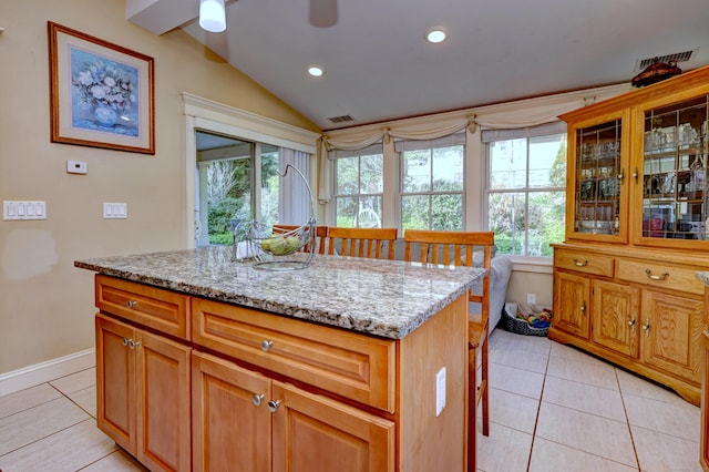 1440 Straits Tpke, Middlebury, CT 06762 - kitchen featuring light stone countertops, recessed lighting, light tile patterned floors, lofted ceiling, and visible vents