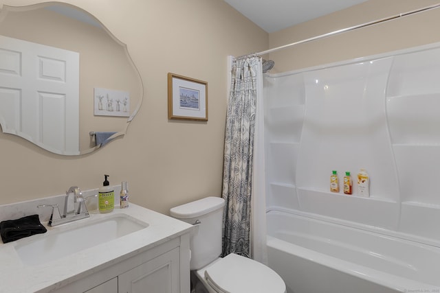 bathroom featuring vanity, shower / bath combo with shower curtain, and toilet