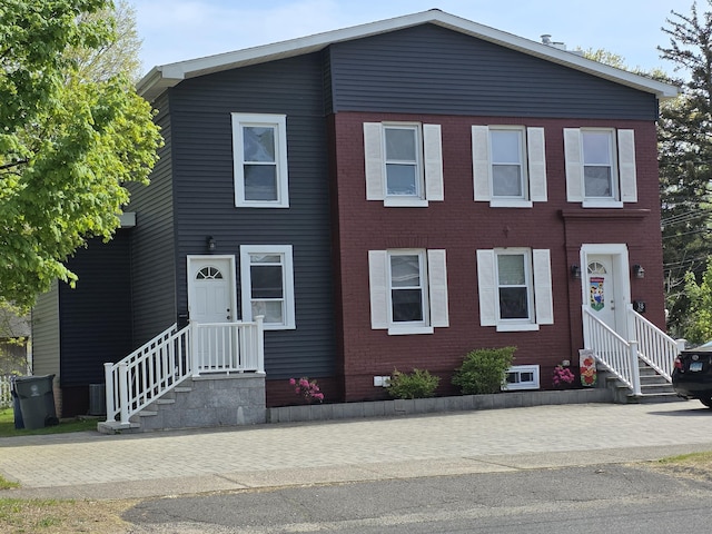 view of front of property with brick siding and entry steps