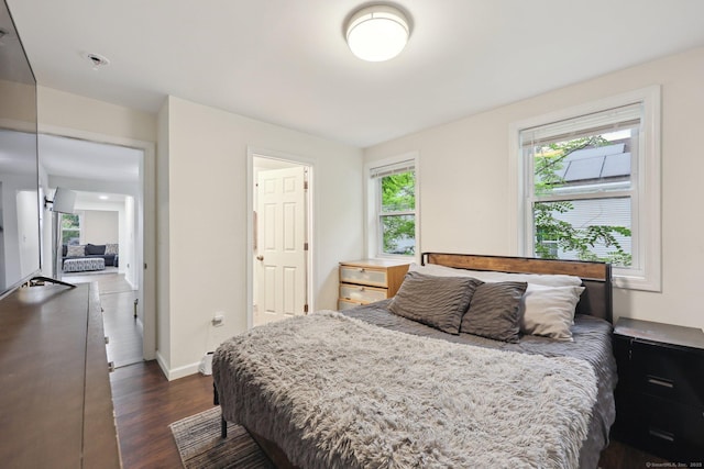 38 Broad St, Plainville, CT 06062 - bedroom with dark wood-style flooring and baseboards