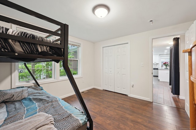 38 Broad St, Plainville, CT 06062 - bedroom featuring dark wood-style floors, baseboards, and a closet