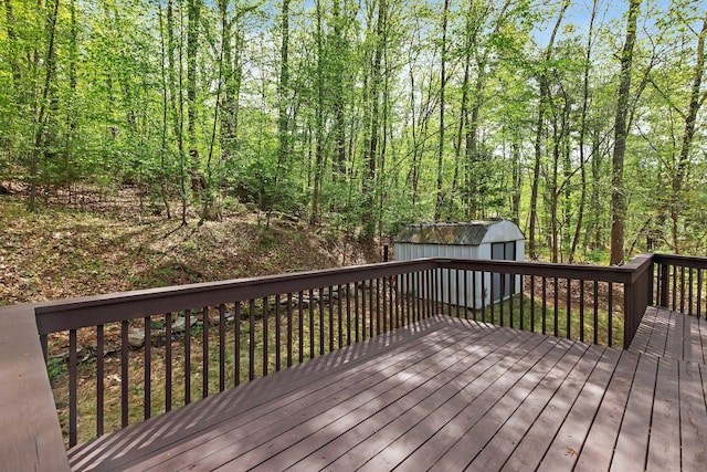 deck featuring an outdoor structure and a storage shed