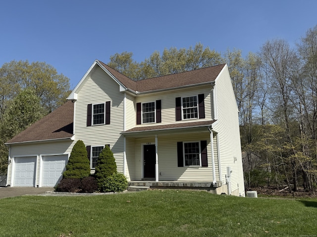123 Hidden Valley Dr, Meriden, CT 06451 - traditional home with a porch, an attached garage, a front yard, and aphalt driveway